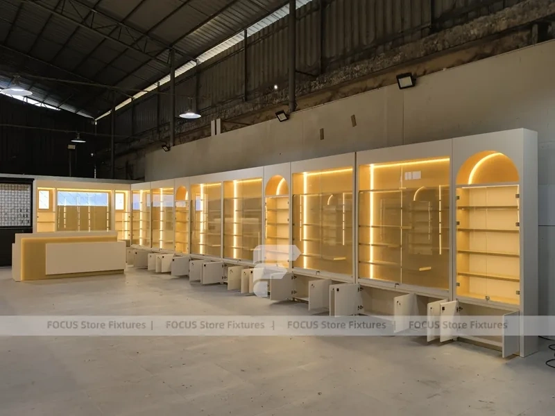 Warm White Perfume Aisle With Arch Shelving