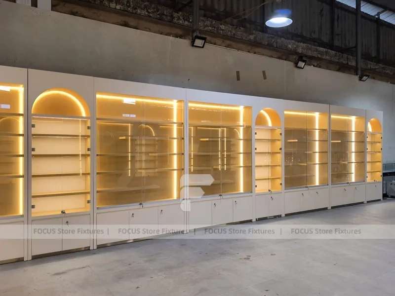 Warm White Perfume Aisle With Arch Shelving