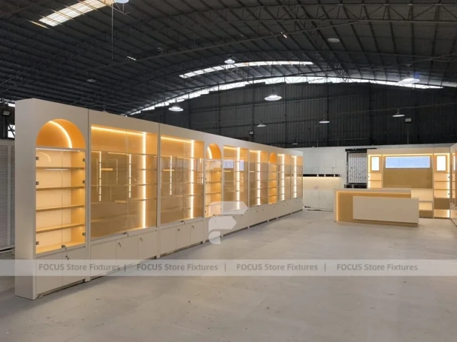 Warm White Perfume Aisle With Arch Shelving