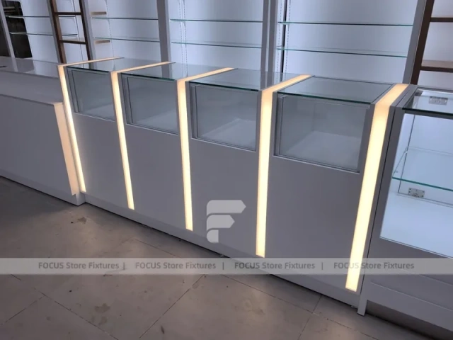 White Perfume Perimeter Wall Display With Round Tester Tables