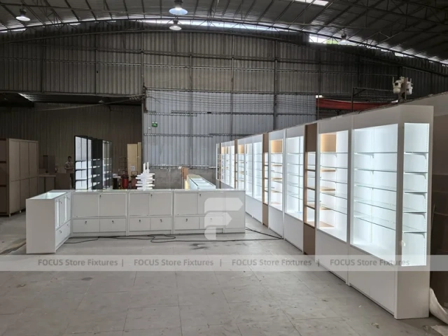 White Perfume Showroom Layout With Corner Shelving