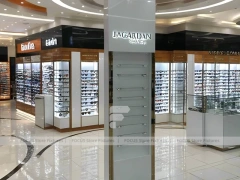 Blush Accent Optical Mall Display with Mirror-Lined Walkway