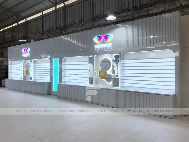 Concept White Eyewear Store Concept with Branded Rail Wall