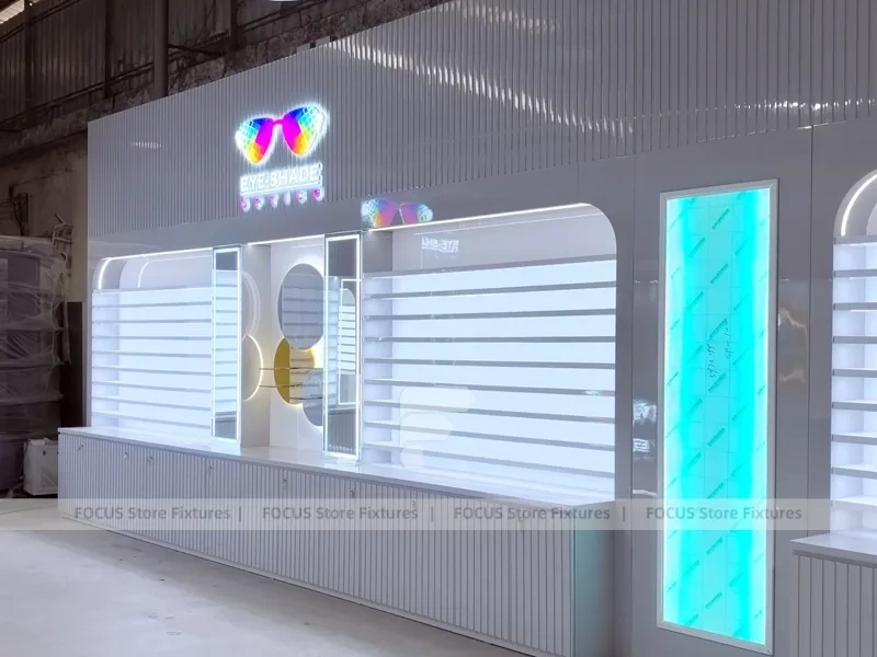 Concept White Eyewear Store Concept with Branded Rail Wall