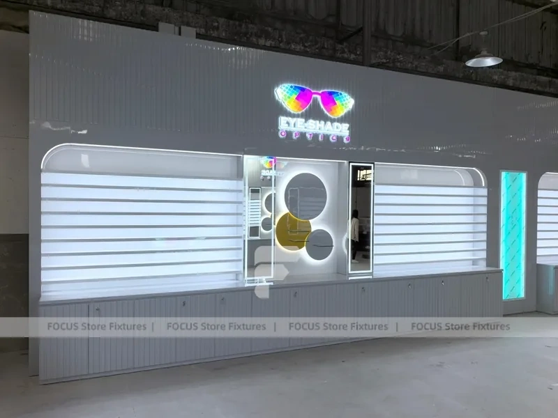 Concept White Eyewear Store Concept with Branded Rail Wall