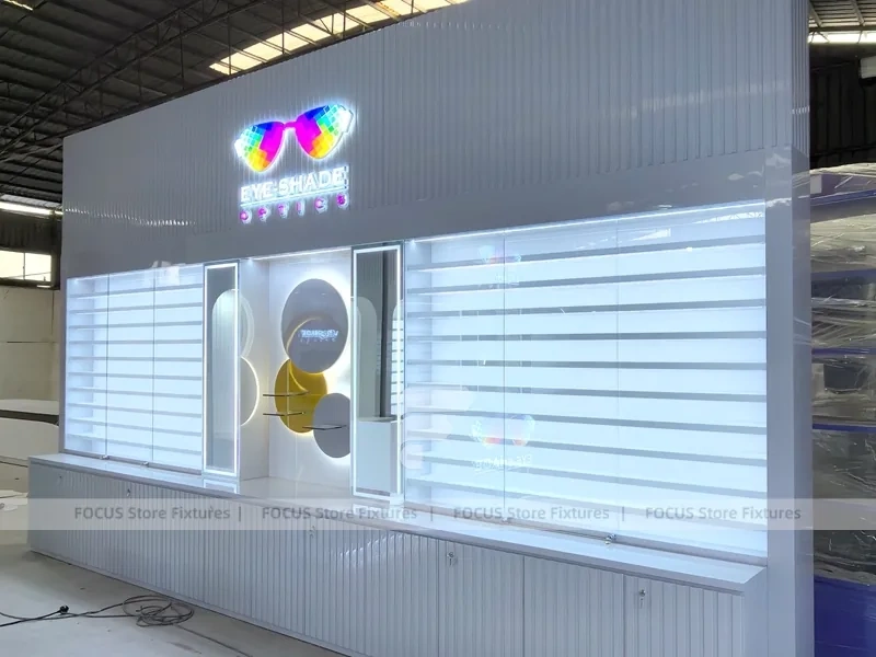 Concept White Eyewear Store Concept with Branded Rail Wall