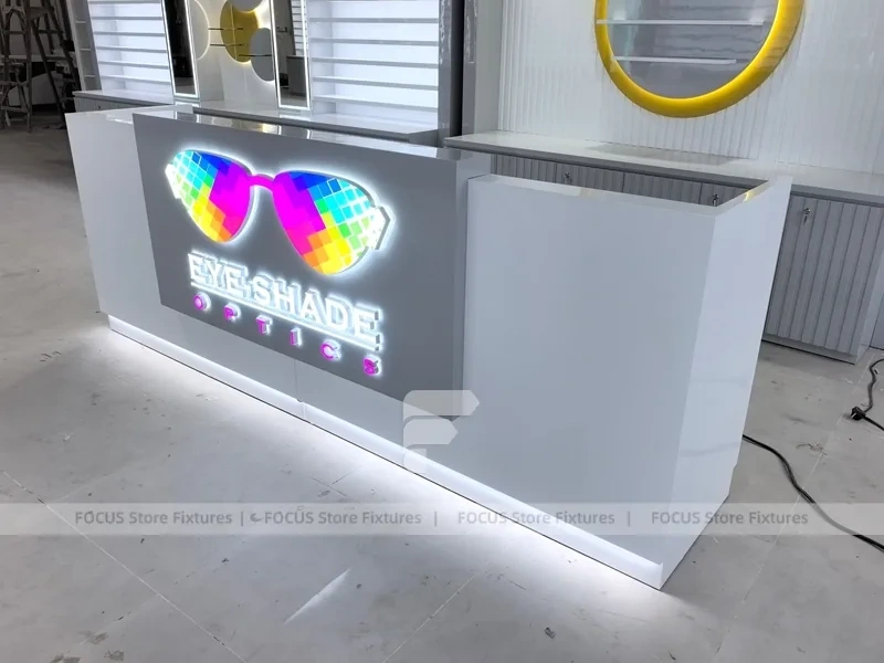 Concept White Eyewear Store Concept with Branded Rail Wall