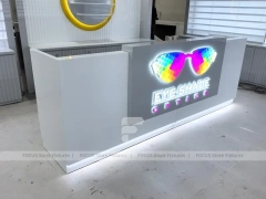 Concept White Eyewear Store Concept with Branded Rail Wall