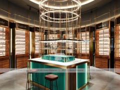 Emerald Luxe Eyewear Gallery Interior with Teal Framed Wall Display