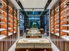 Gold Accent Optical Corridor Gallery with Warm Accent Facade