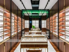 Gold Accent Optical Corridor Gallery with Warm Accent Facade