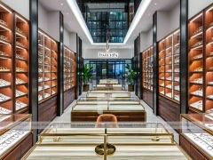 Gold Accent Optical Corridor Gallery with Warm Accent Facade