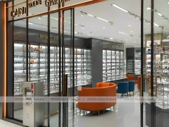 Golden Corridor Eyewear Boutique Hall with Warm Accent Facade