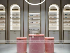 Green Accent Optical Consultation Lounge with Arched Display Alcoves