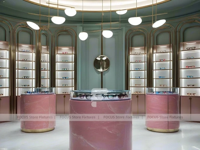 Green Accent Optical Consultation Lounge with Round Pink Pedestals