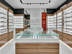 Modular White Eyewear Retail Layout with Black Core Tower