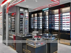 Red Accent Optical Concept Store with High-Contrast Wall Display