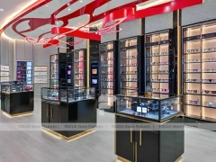 Red Accent Optical Concept Store with High-Contrast Wall Display