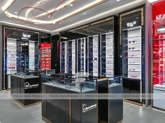 Red Accent Optical Concept Store with High-Contrast Wall Display