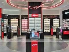 Red Neon Vision Retail Stage with Racing-Inspired Ceiling Feature