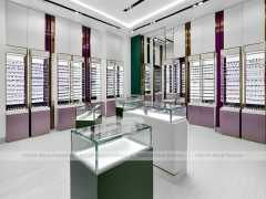 Soft Plum Optical Boutique Display with Green Accent Tower