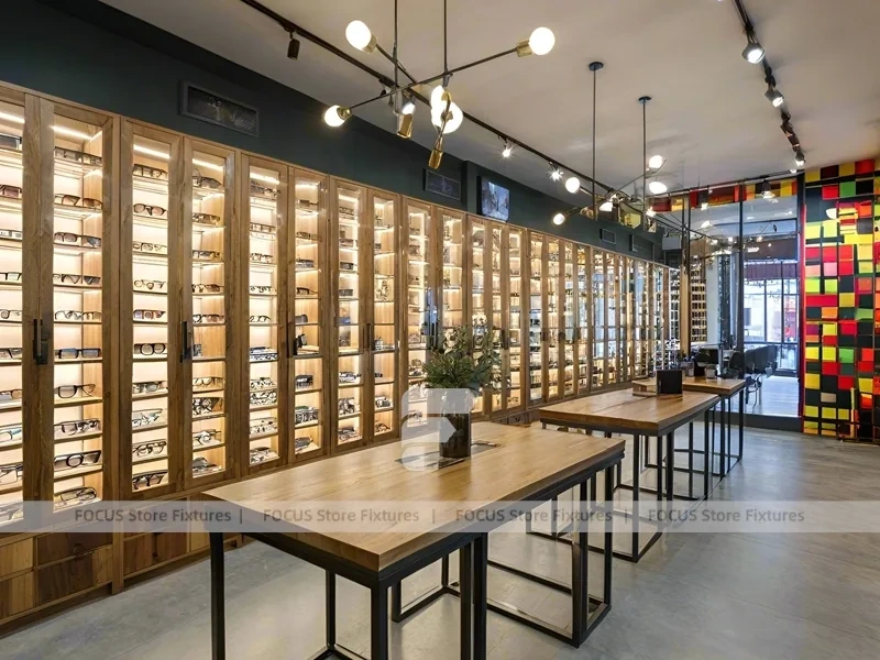 Teal Gold Eyewear Gallery Interior with Chandelier-Lit Island