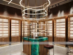 Teal Gold Eyewear Gallery Interior with Chandelier-Lit Island