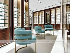 Teal Gold Vision Retail Showcase with Chandelier-Lit Island