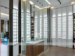 Wood and Emerald Vision Boutique Corridor with Suspended Display Frames