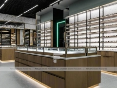 Woodgrain Optical Statement Boutique with Chandelier-Lit Island