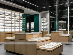 Woodgrain Optical Statement Boutique with Chandelier-Lit Island