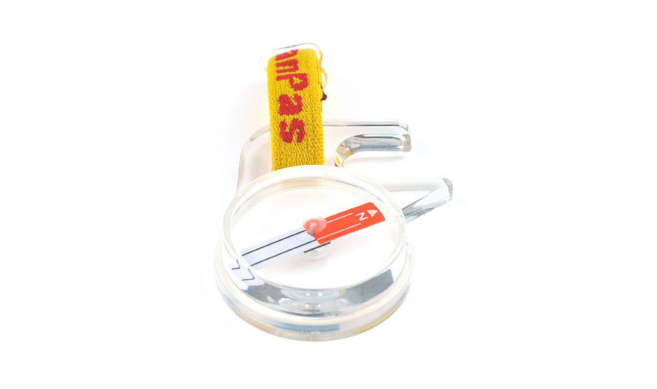 Compact backup compass for emergency navigation in the wilderness.