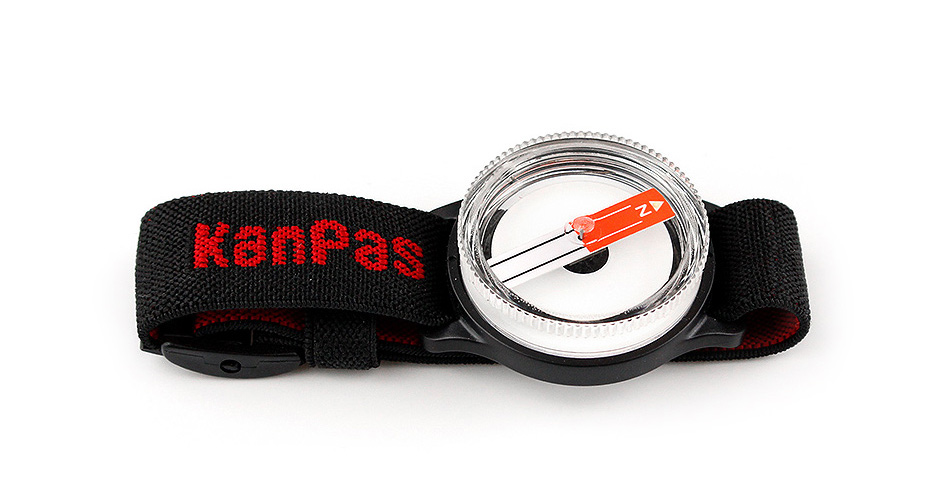 Precision magnetic compass with liquid-filled capsule for smooth movement.