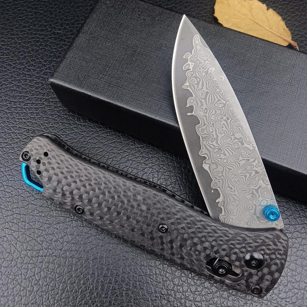 Tactical folding knife, textured grip carbon fiber handle with blue accents, ergonomic EDC camping knife suitable for outdoor survival and daily carrying, high hardness blade, spear tip Damascus steel blade, good gift, knife fan collector