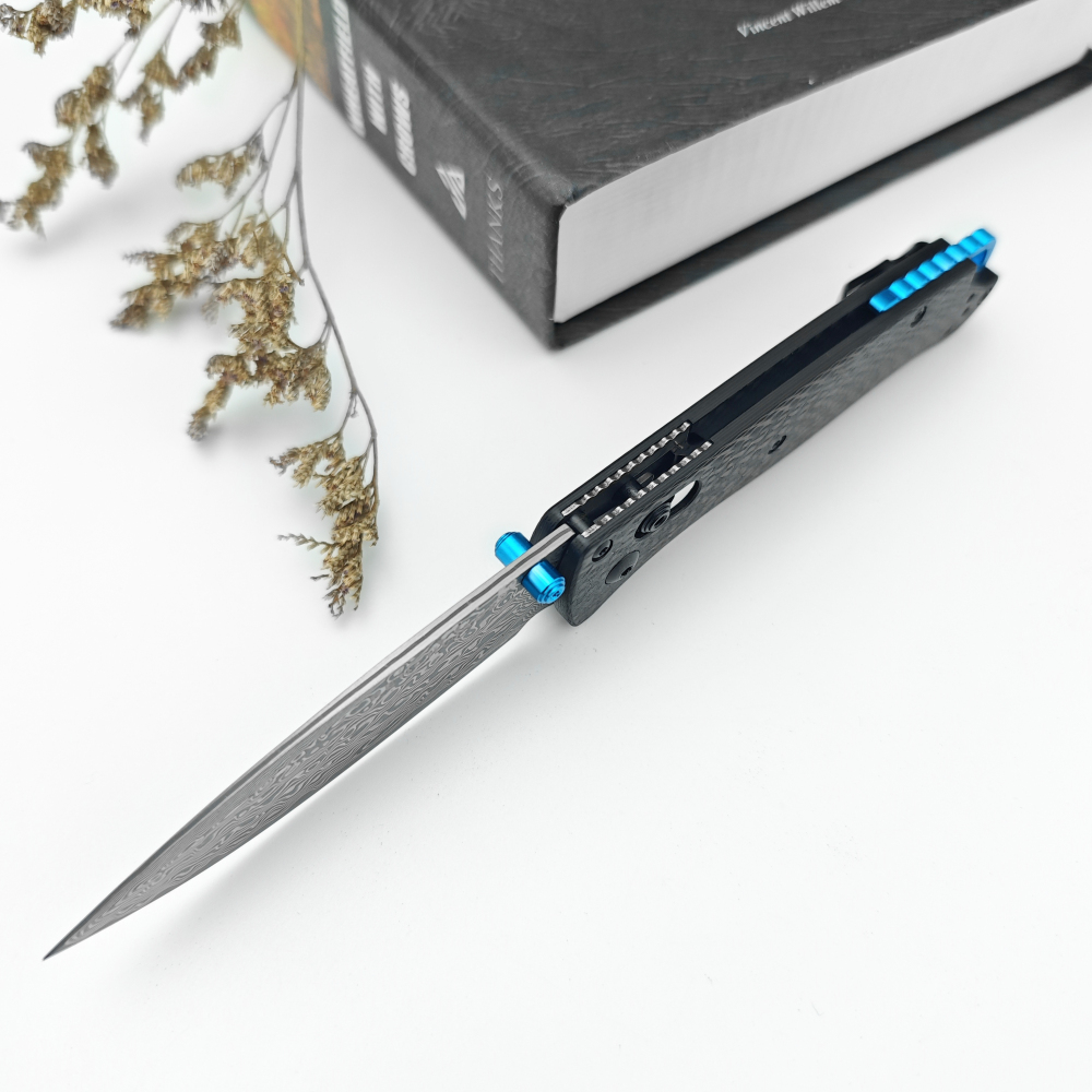 Tactical folding knife, textured grip carbon fiber handle with blue accents, ergonomic EDC camping knife suitable for outdoor survival and daily carrying, high hardness blade, spear tip Damascus steel blade, good gift, knife fan collector