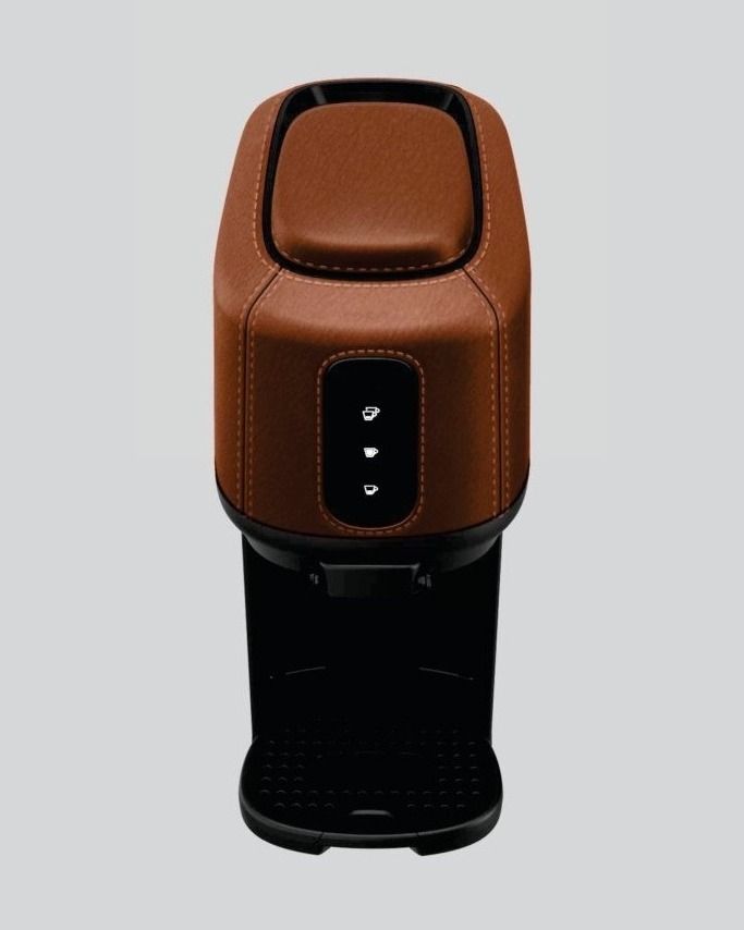 Coffee machine housing finished with a leather-grain laser texture