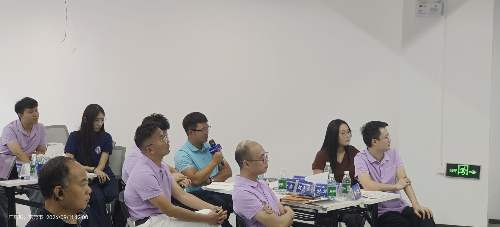 The instructor teaching in front of the class