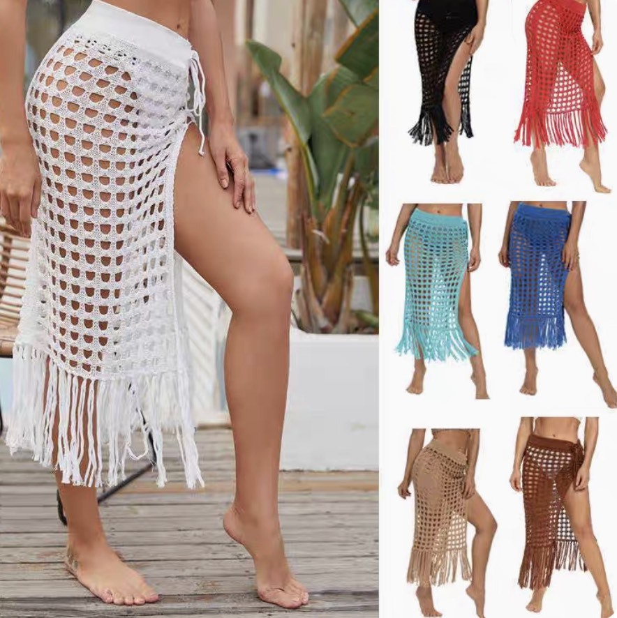 Spring and summer new European women's sexy hollowed-out knitted skirt slit fringe degree beach skirt women