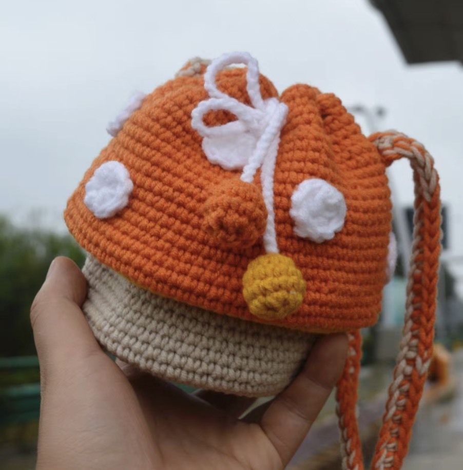 Handmade Crochet Mushroom Drawstring Backpack – Orange & Beige Toadstool Bag with 3D Polka Dots and Yarn Pom-Poms