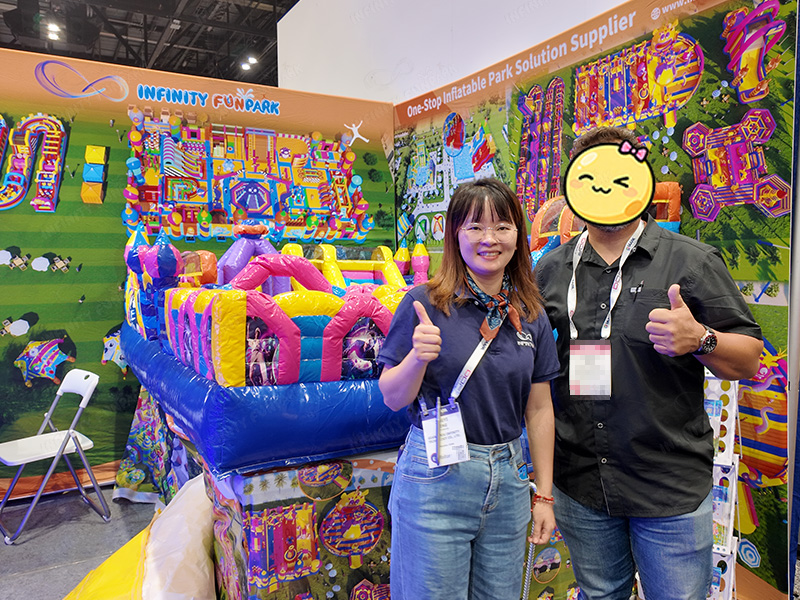 Infinity Funpark team with international client at IAAPA Expo 2025
