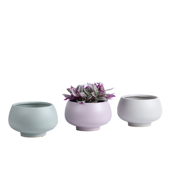 Matte glazed ceramic plant pot with fluted design