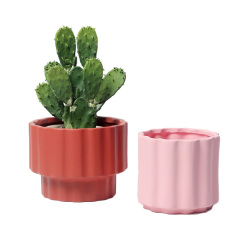 JYW2149 Fluted ceramic indoor plant pot with elevated bottom