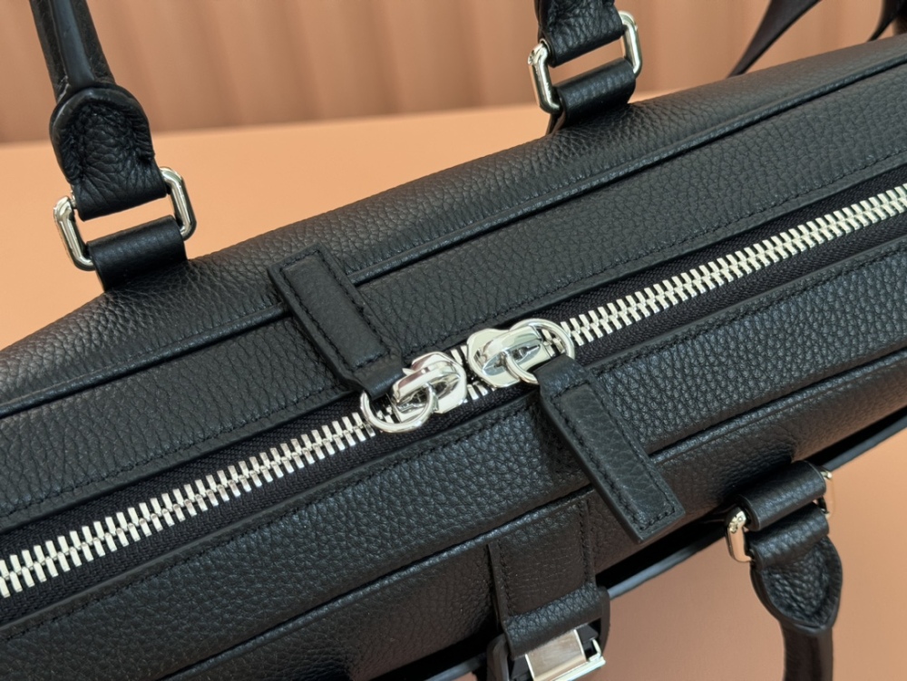 The briefcase is crafted with exquisite grain leather