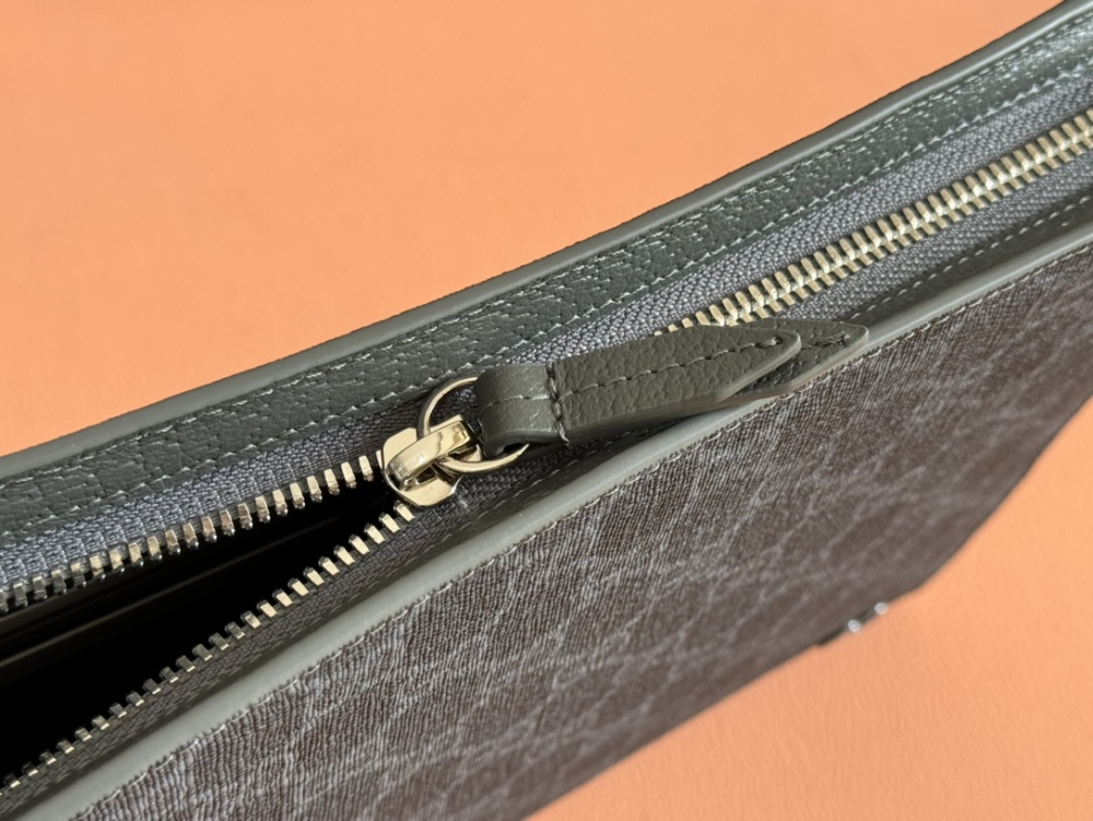 Handbag with interwoven letter patterns