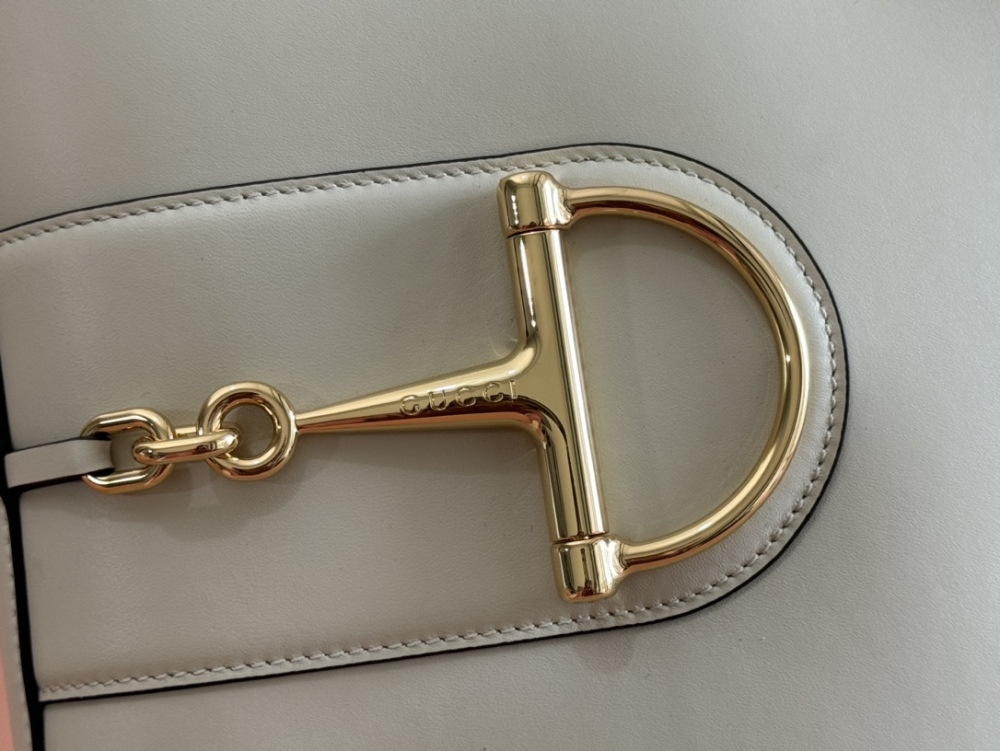 Horse carrying buckle crossbody bag
