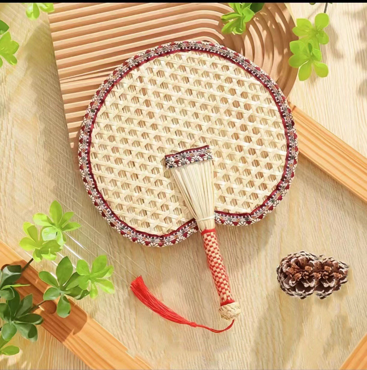 Beat the Heat in Style with Our Handwoven Raffia Fan – A Blend of Tradition and Comfort!