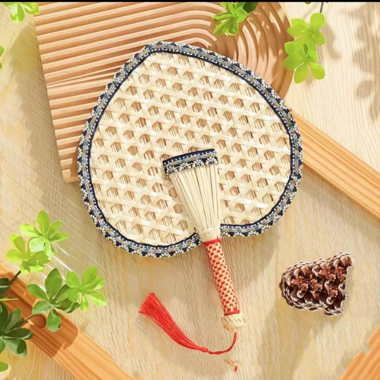 Beat the Heat in Style with Our Handwoven Raffia Fan – A Blend of Tradition and Comfort!