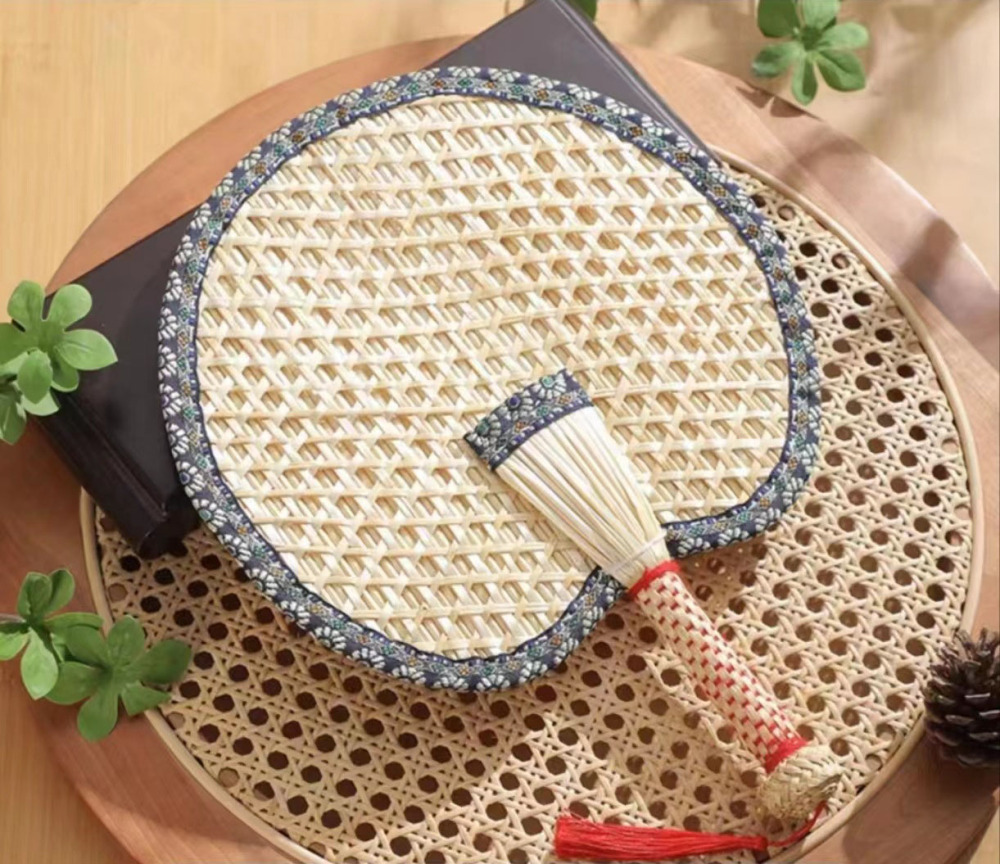 Beat the Heat in Style with Our Handwoven Raffia Fan – A Blend of Tradition and Comfort!