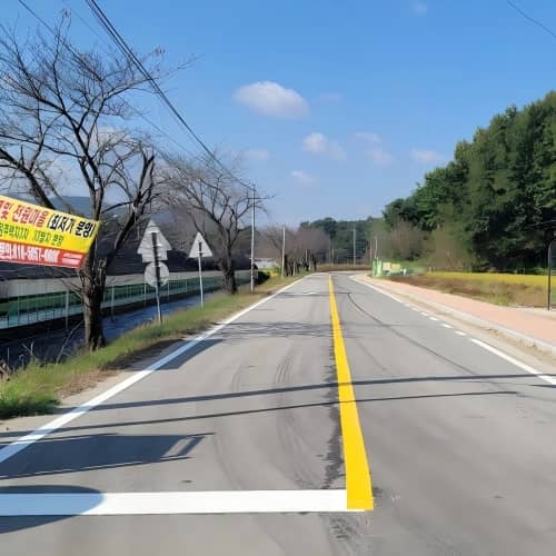 Application of BOLE thermoplastic paint using a road marking machine during a school zone project in Incheon, South Korea