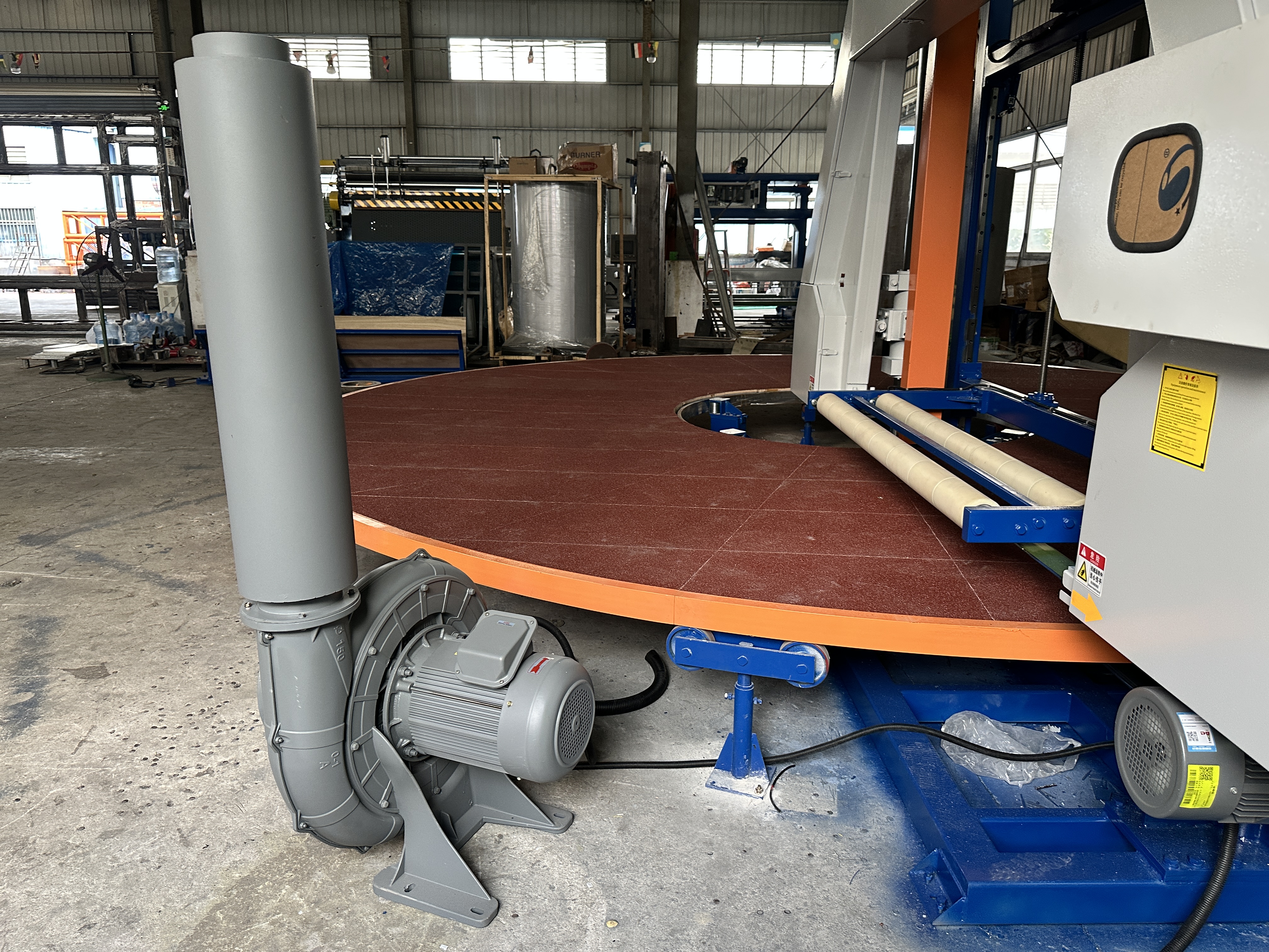 Detailed view of carrousel splitting foam cutting machine control panel and precision cutting mechanism